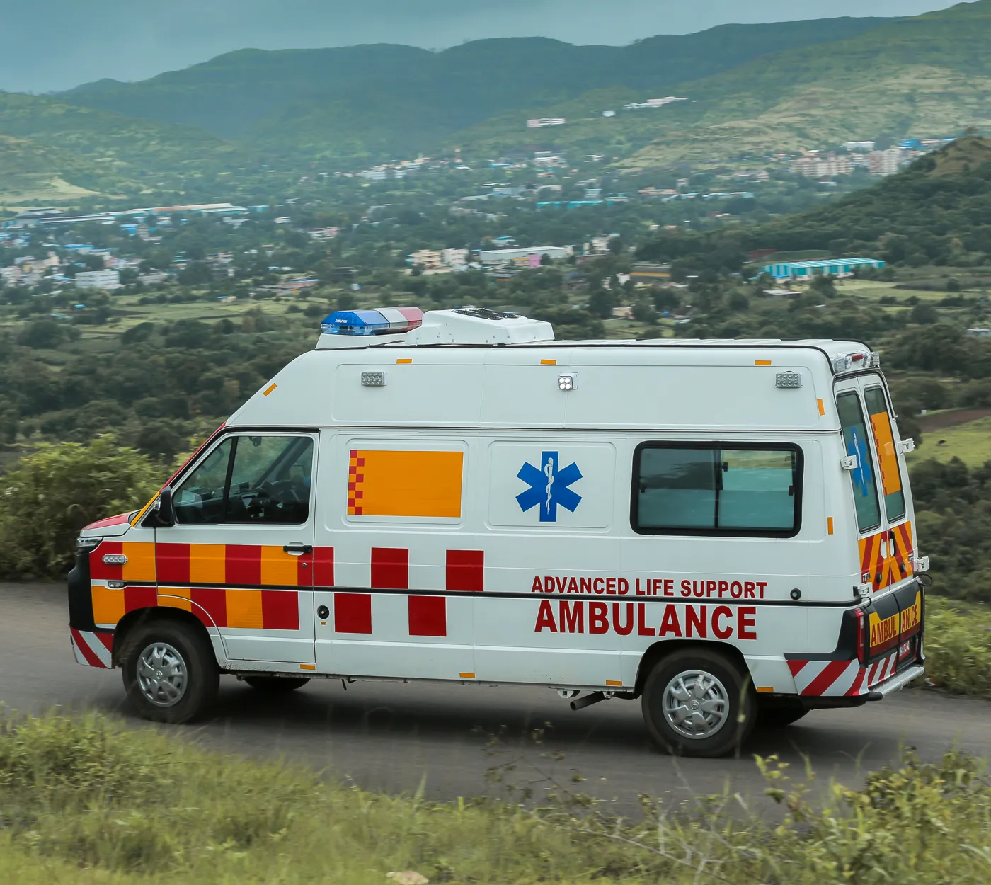 The hospital's life-support ambulance on a hill road