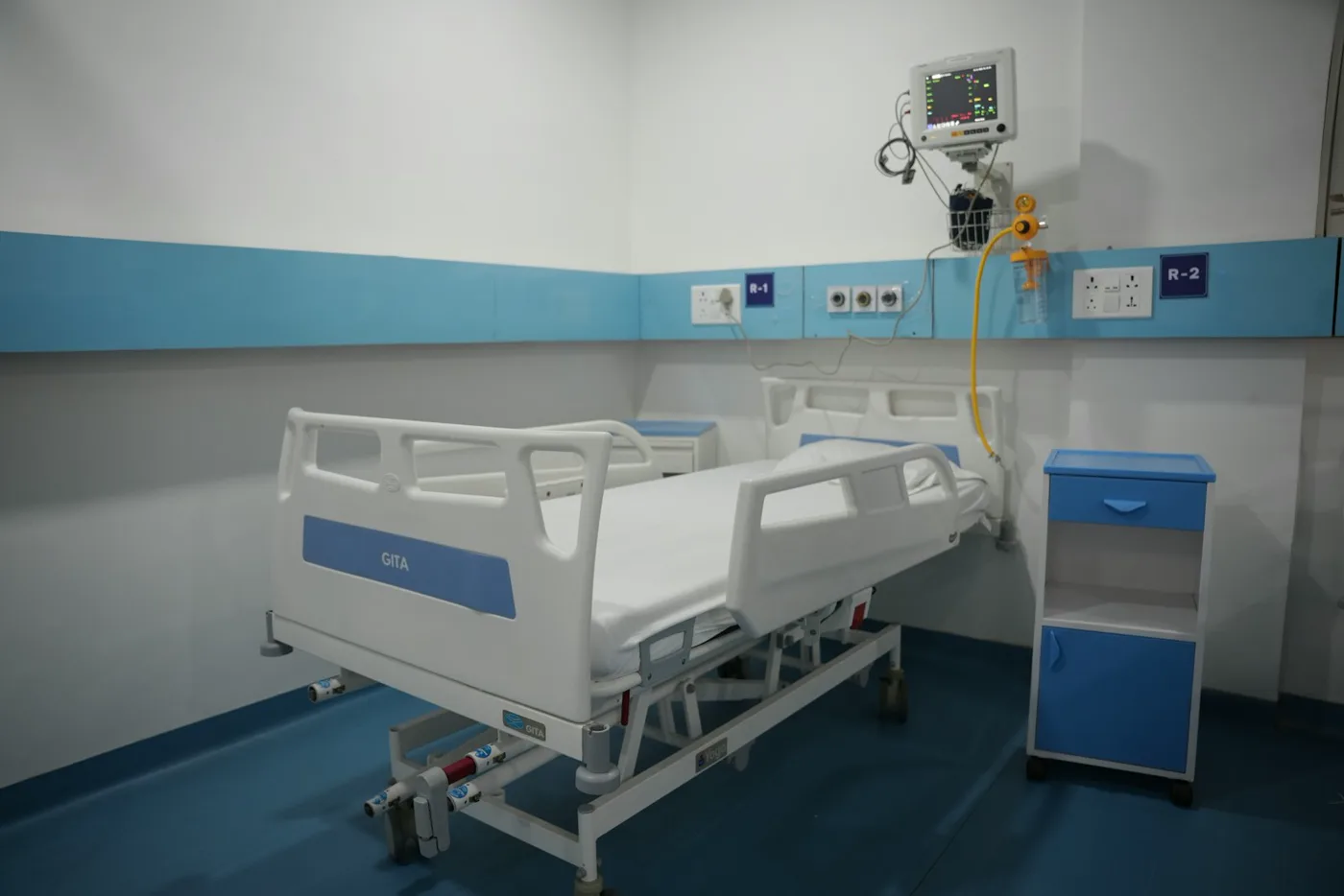 A private patient room with a hospital bed