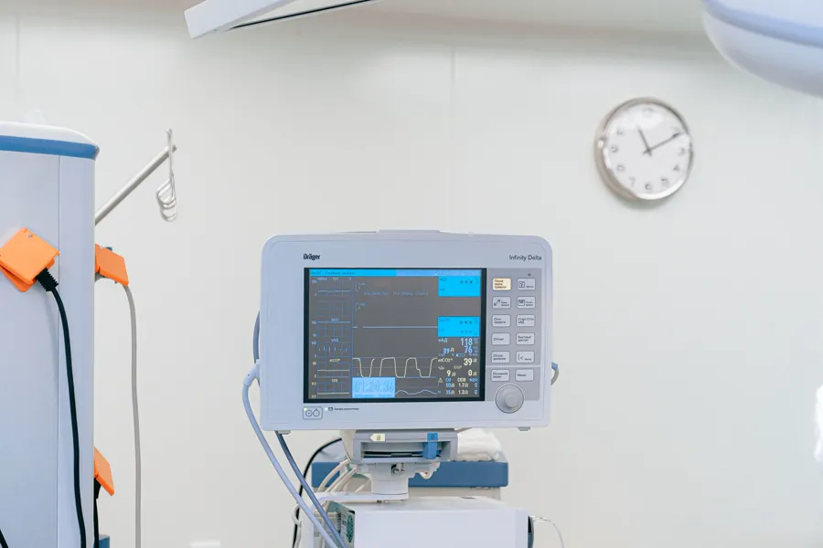A monitor beside an ICU bed