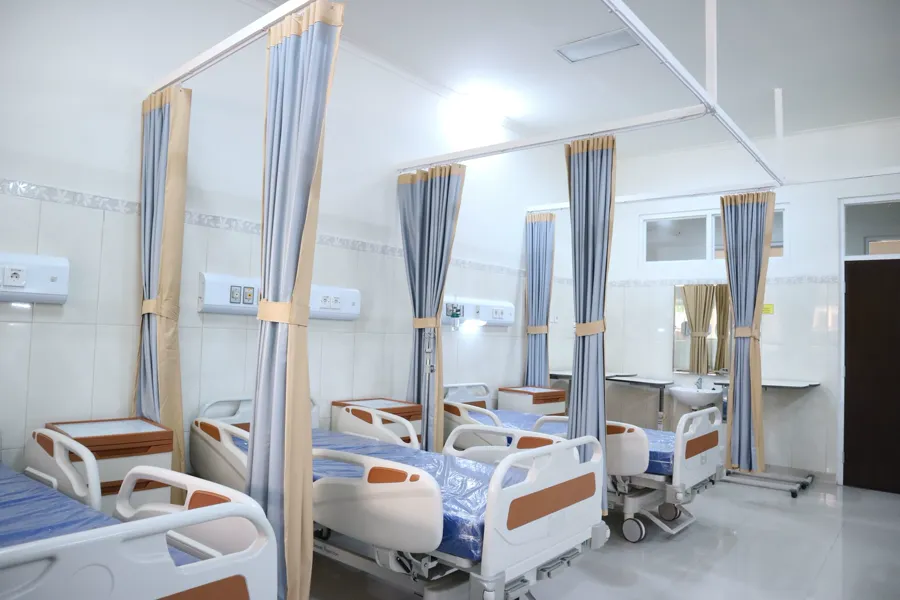 The general ward with curtained beds